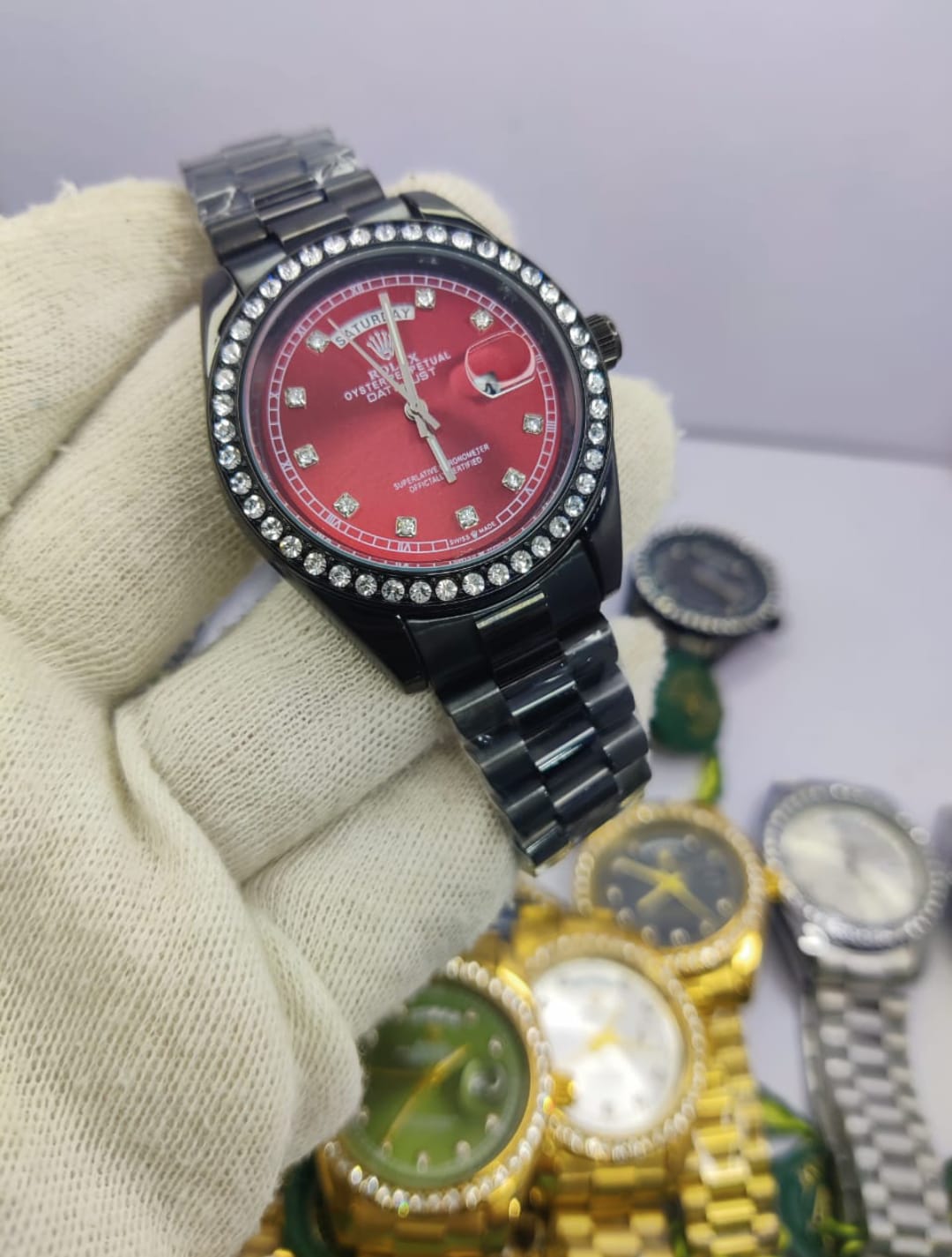 Rolex All Black Diamond-Cut Stone men’s watch with red dial