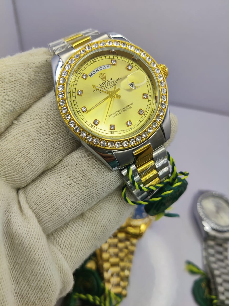 Rolex Oyster Perpetual Two-Tone Diamond-Cut men’s watch with gold dial and rubber strap