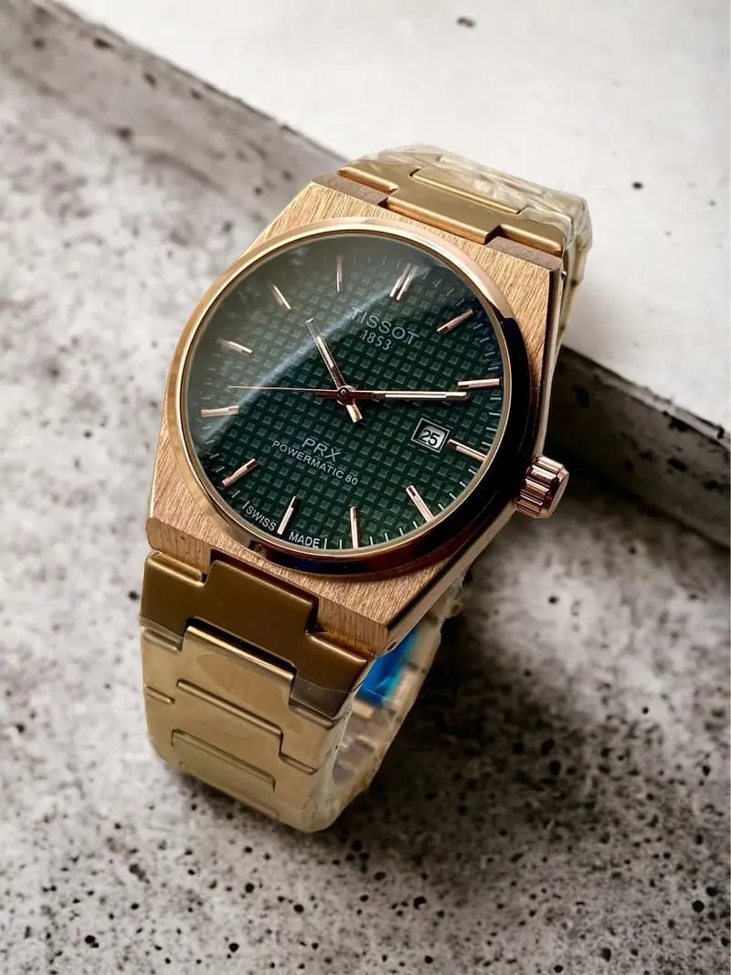 Tissot PRX Powermatic 80 men’s watch with green dial and gold accents on stainless steel bracelet