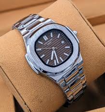 Patek Philippe style watch with brown dial and stainless steel strap – classic style