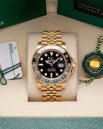 Rolex GMT-Master II men’s watch with gold adition case and black dial