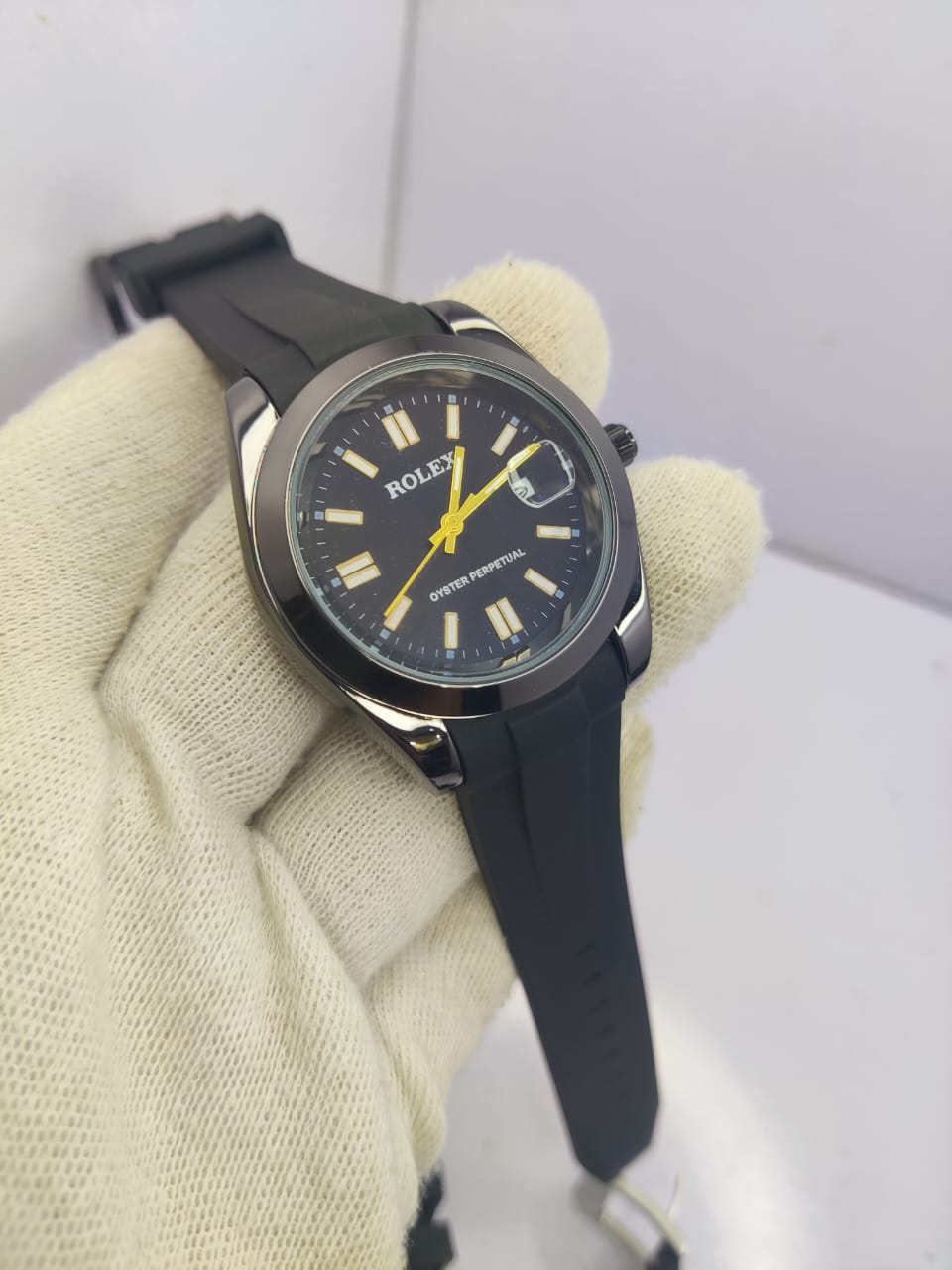 Rolex Oyster Perpetual men’s watch with black dial and rubber strap