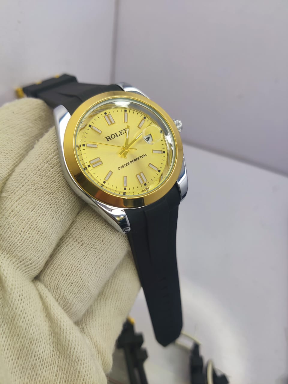 Rolex Oyster Perpetual men’s watch with gold dial and rubber strap