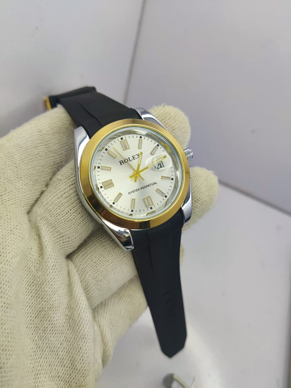 Rolex Oyster Perpetual men’s watch with gold and white dial and rubber strap