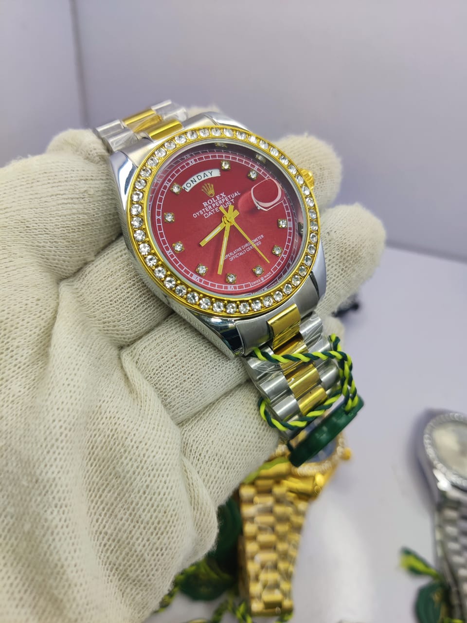 Rolex Oyster Perpetual Two-Tone Diamond-Cut men’s watch with red dial and rubber strap