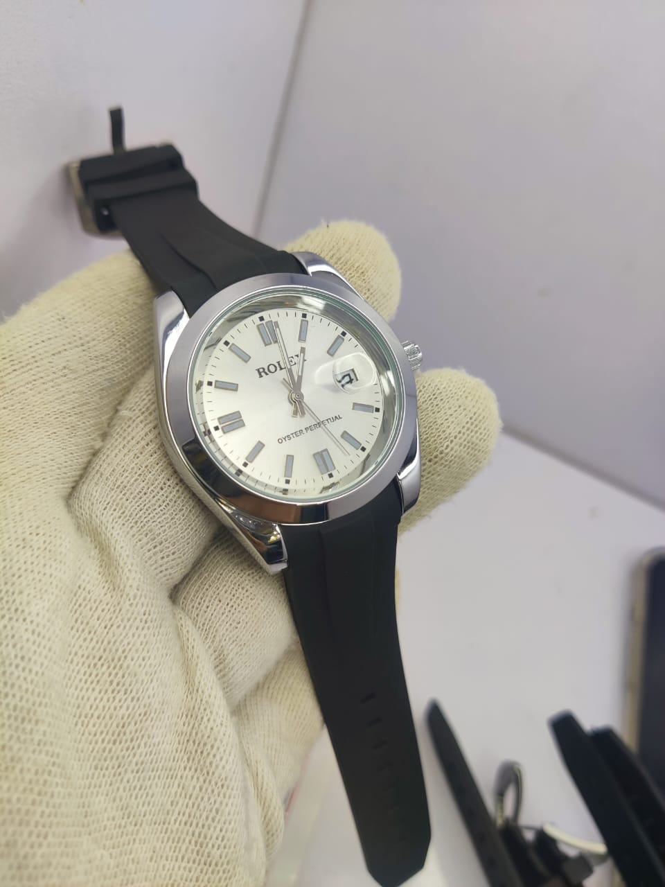 Rolex Oyster Perpetual men’s watch with white dial and rubber strap