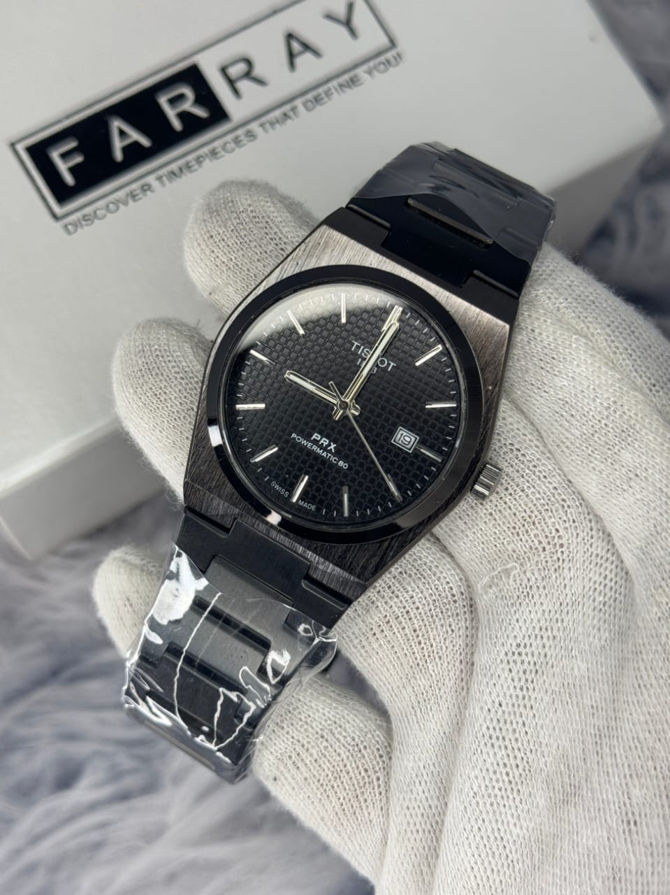 Alt Text: Tissot PRX Powermatic 80 men’s watch with black dial and stainless steel bracelet