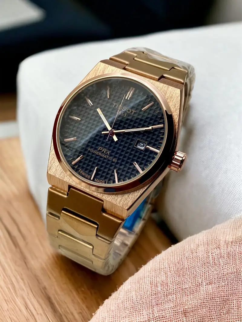 Tissot PRX Powermatic 80 men’s watch with gold accents and stainless steel bracelet
